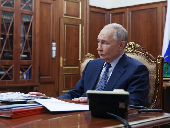 Vladimir Putin attends a meeting with Russia’s Emergency Situations Minister at the Kremlin. Picture: AFP