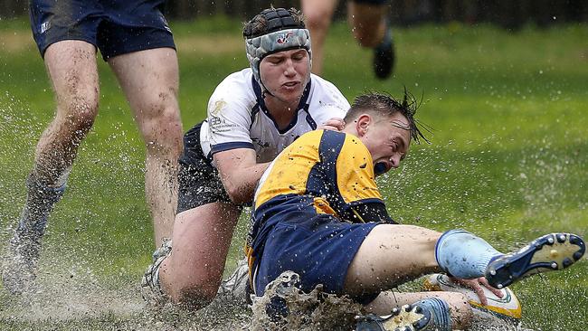 NSW's Joe Hutton tackles ACT's Jake Mead. Pic: John Appleyard