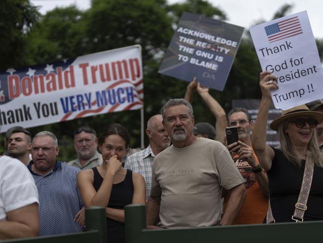 White South Africans demonstrate in support of U.S. President Donald Trump in front of the U.S. embassy in Pretoria, South Africa, Saturday, Feb. 15, 2025. (AP Photo/Jerome Delay)