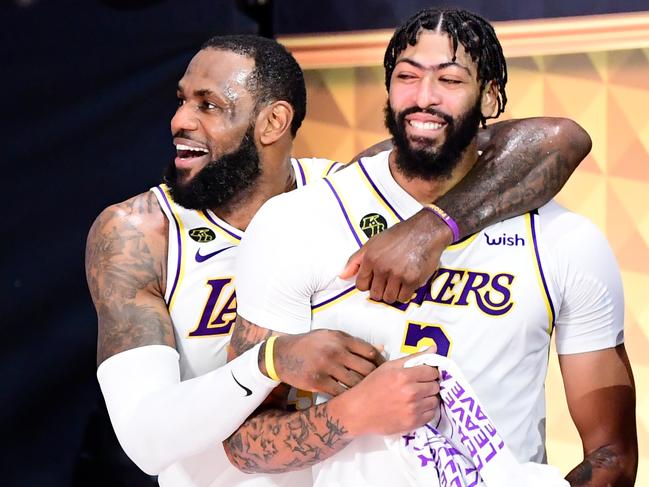 LAKE BUENA VISTA, FLORIDA - OCTOBER 11: LeBron James #23 of the Los Angeles Lakers and Anthony Davis #3 of the Los Angeles Lakers react after winning the 2020 NBA Championship in Game Six of the 2020 NBA Finals at AdventHealth Arena at the ESPN Wide World Of Sports Complex on October 11, 2020 in Lake Buena Vista, Florida. NOTE TO USER: User expressly acknowledges and agrees that, by downloading and or using this photograph, User is consenting to the terms and conditions of the Getty Images License Agreement.  (Photo by Douglas P. DeFelice/Getty Images)