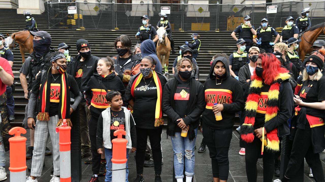 Protesters gather at State Parliament to rally against Australia Day. Picture: Jake Nowakowski