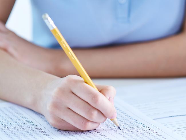 Unrecognizable girl taking exam