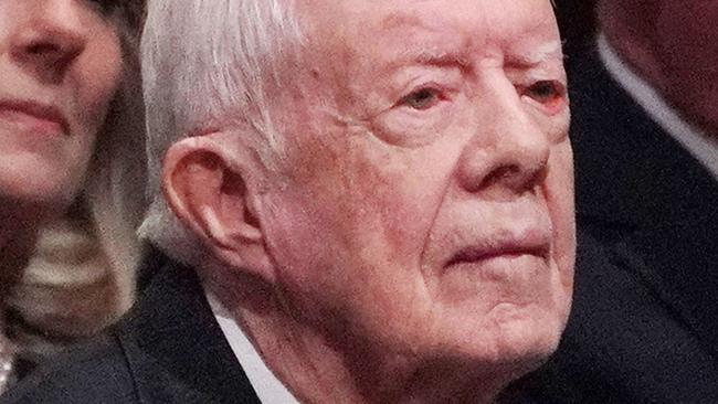 (FILES) In this file photo taken on December 5, 2018 former US president Jimmy Carter attends the funeral service for former US president George H. W. Bush at the National Cathedral in Washington, DC on December 5, 2018. - Carter, the 98-year-old former US president who led the nation from 1977 to 1981, is receiving hospice care at home where he will spend his "remaining time," his nonprofit foundation said on February 18, 2023. After a series of short hospital stays, former US President Jimmy Carter today decided to spend his remaining time at home with his family and receive hospice care instead of additional medical intervention," the Carter Center said in a statement posted to Twitter. (Photo by MANDEL NGAN / AFP)