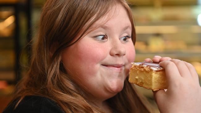 Maggie Spencer, 14, enjoys a vanilla slice from Banana Boogie. Picture: Keryn Stevens