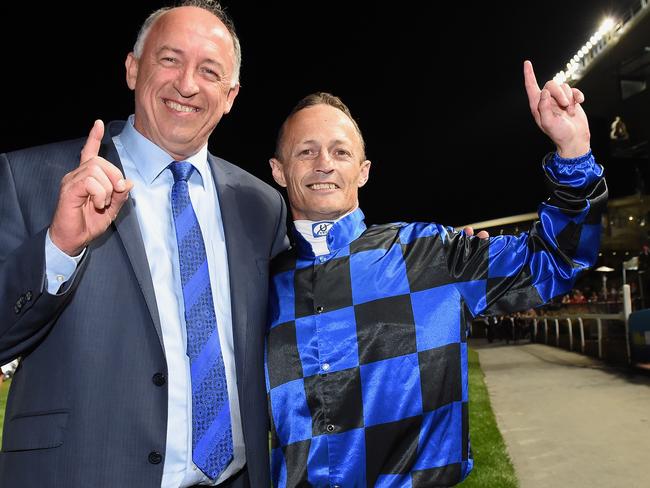 Jockey Damian Browne and trainer Robert Heathcote celebrate another one of Buffering’s many memorable victories. Picture: Andy Brownbill