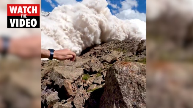 Terrifying moment tourist swallowed by avalanche