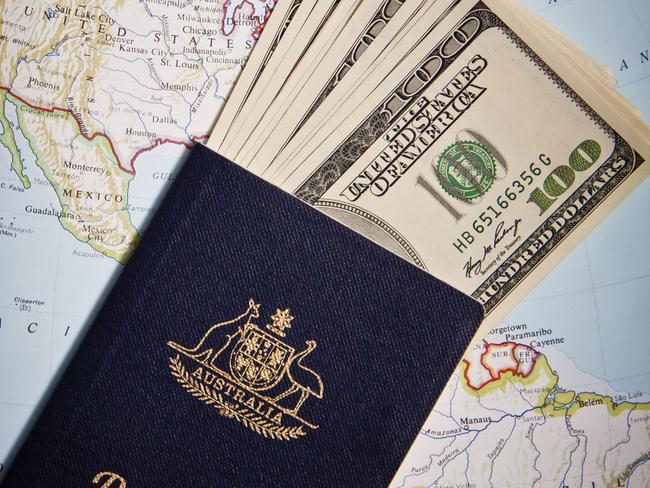 Australian passport and US banknotes with Map background