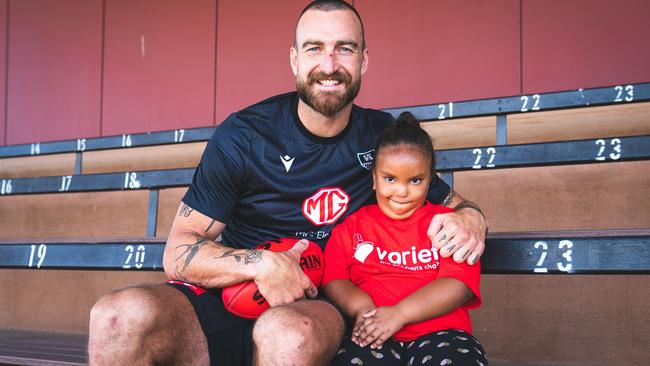 Variety donor recipient Mackayla Grigg with Charlie Dixon at Alberton Oval. Picture: Supplied