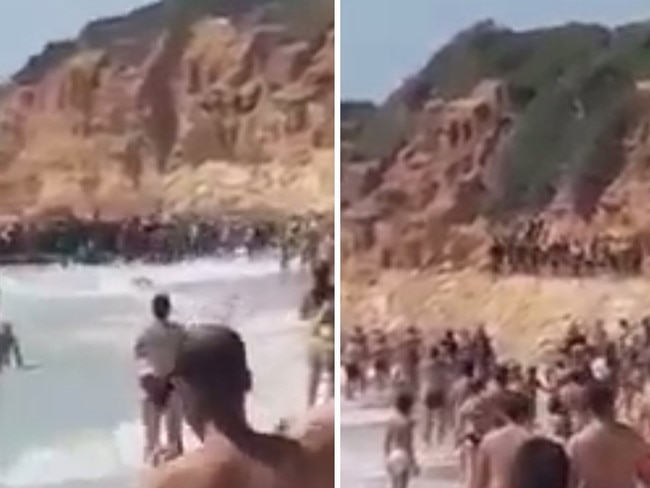 ONE TIME WEB USE ONLY - FEE APPLIES FOR REUSE - Migrants arrive on tourist beach in Spain. Picture: Solarpix/Australscope