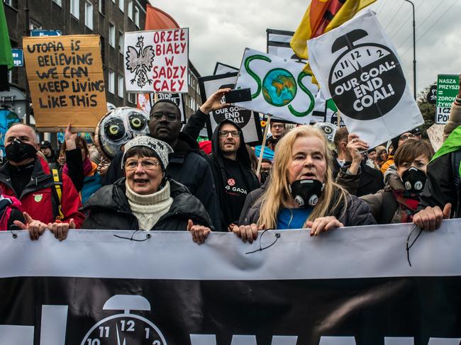 KATOWICE, POLAND - DECEMBER 08: Environmental protesters take part in a Greenpeace organised march to call for the political and economic reforms needed to combat climate change while the 24th summit of the United Nations on Climate Change (COP24) takes place in the city on December 8, 2018 in Katowice, Poland. The summit is being considered the most important since the 2015 meeting in Paris.  (Photo by Martyn Aim/Getty Images)