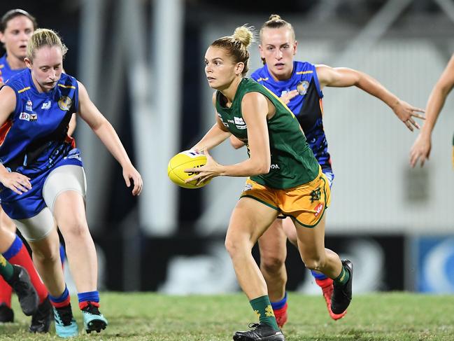 St Marys star Jasmine Anderson breaks clear from the Tracy Village pack. Picture: Felicity Elliott/AFLNT Media