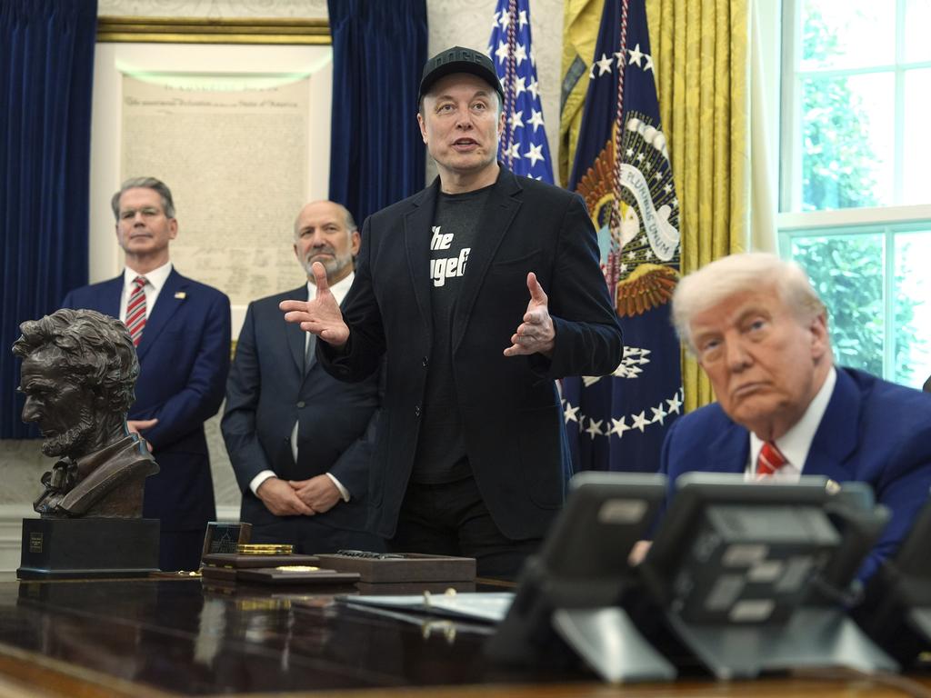 Elon Musk speaks during his final news conference with President Donald Trump, right, as Treasury Secretary Scott Bessent, from left, and Commerce Secretary Howard Lutnick, listen in the Oval Office of the White House on May 30. Picture: AP Photo