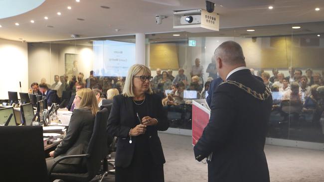 Deputy Mayor Donna Gates in last minute talks with the Mayor Tom Tate and Cameron Caldwell before a meeting begins. Picture Glenn Hampson.