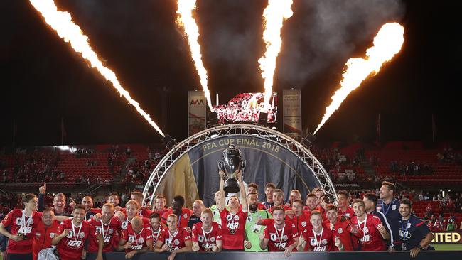 Adelaide United players celebrate winning the FFA Cup at Hindmarsh Stadium in 2018. Picture: Sarah Reed