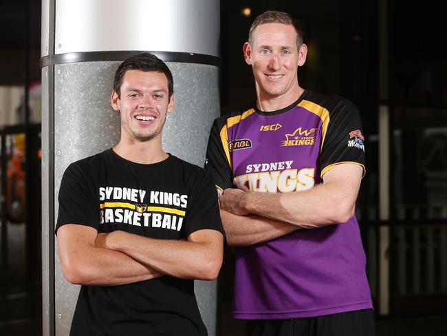 Sydney Kings assistant Ben Knight (R) with current players Jason Cadee.