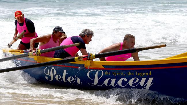 Peter Devenport in action on a surf boat. Photo: David Clark