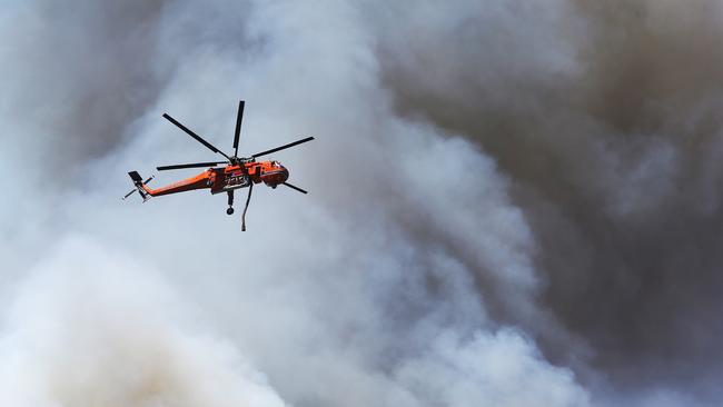 A fatal car crash has sparked an out of control bush fire south of Kurri Kurri at Pelaw Main. Picture: Peter Lorimer.