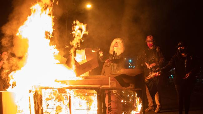 Protesters set a sofa on fire in West Philadelphia on Tuesday during a demonstration against the fatal shooting Walter Wallace. Picture: Gabriella Audi/AFP