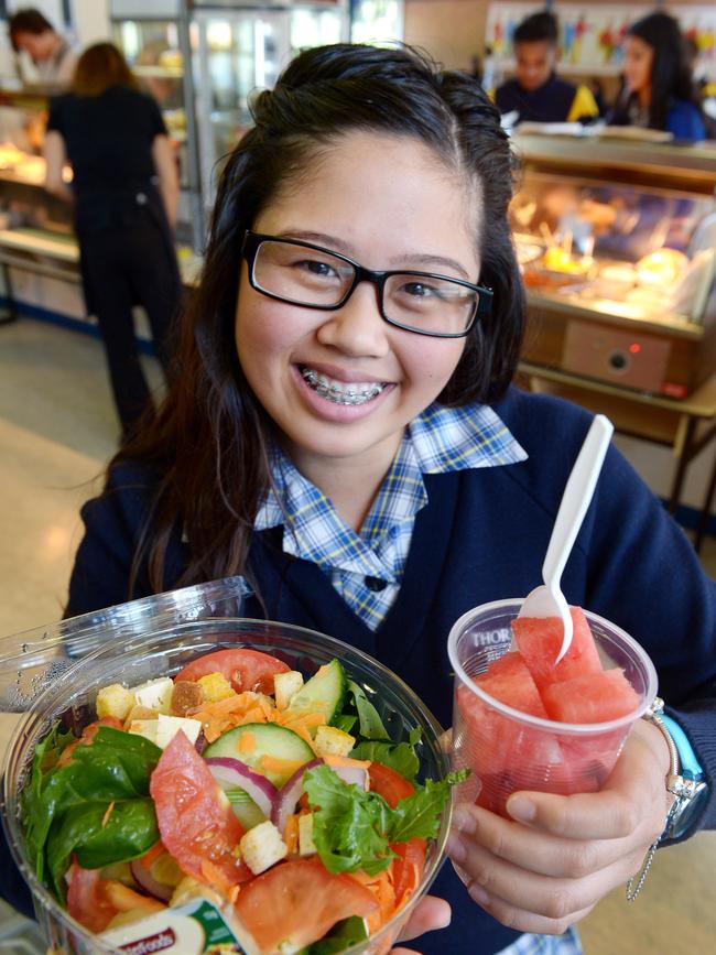 Thornbury High School is one of only two in Melbourne to get a Nutrition Australia tick of approval for it's canteen. Year 12 school captain Michelle Lopez with a healthy serve of food from the canteen. Picture: Steve Tanner.