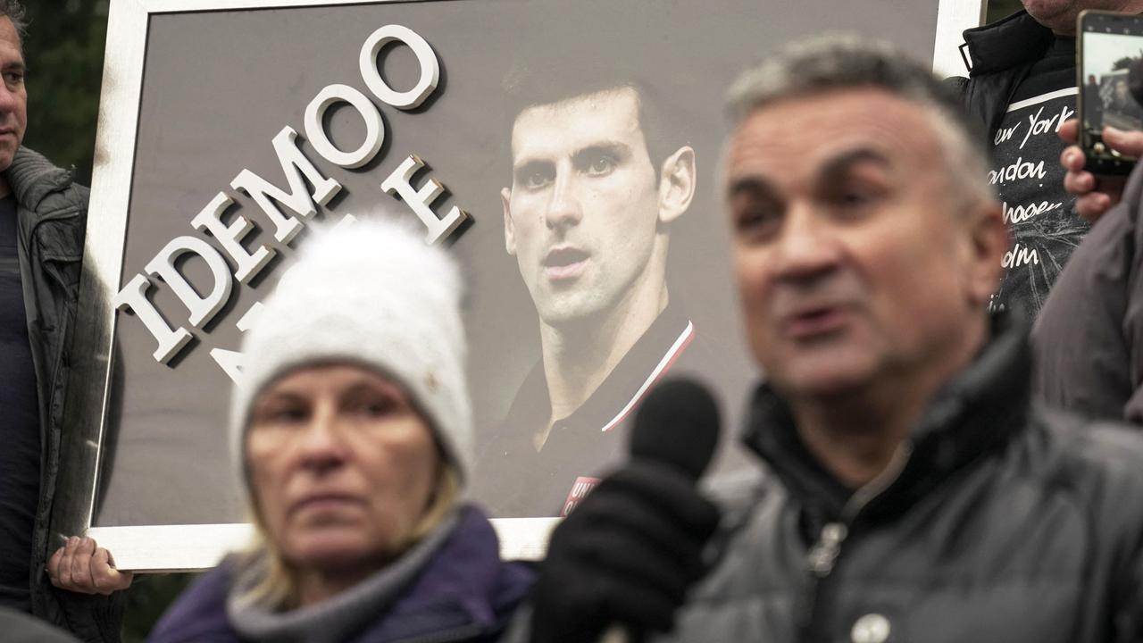 Serbian tennis player Novak Djokovic's father Srdjan Djokovic (R) speaks flanked by his wife Dijana Djokovic.