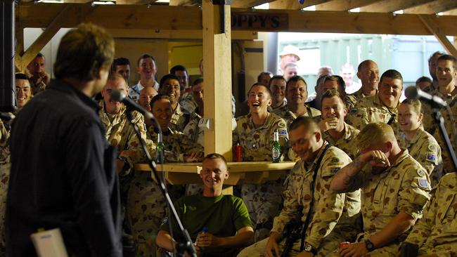 Lehmo warms up the troops with a few jokes during the Forces Entertainment Tour concert in Tarin Kowt, Afghanistan.