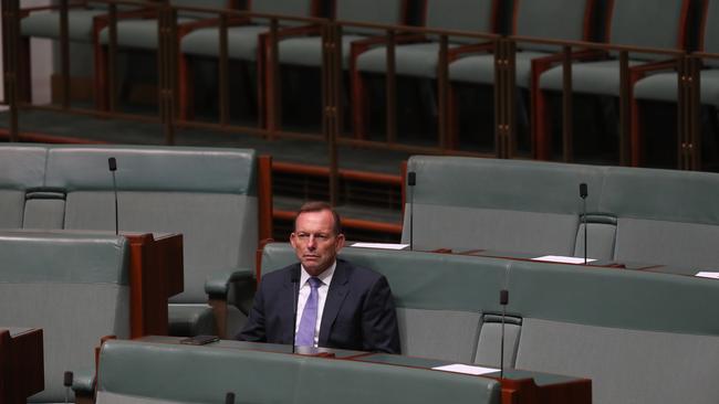 Tony Abbott listening to  PM Scott Morrison speaking on Closing the Gap Statement in the House of Representatives Chamber at Parliament House in Canberra. Picture Kym Smith