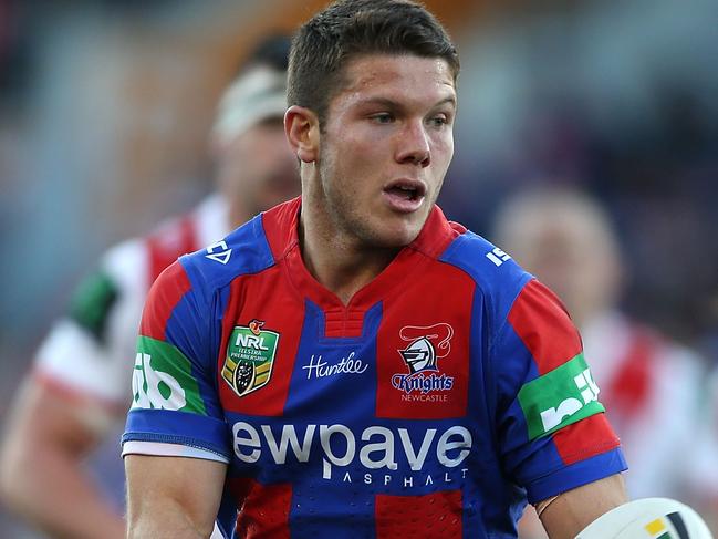 NEWCASTLE, AUSTRALIA - JUNE 25: Jack Cogger of the Knights passes the ball during the round 16 NRL match between the Newcastle Knights and the St George Illawarra Dragons at Hunter Stadium on June 25, 2016 in Newcastle, Australia.  (Photo by Tony Feder/Getty Images)