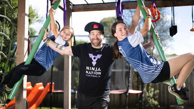 Mark Stevens with his daughters, Jordyn Stevens (8) and sister Charli (12) who have qualified for the Australian Ninja Warrior team - competing in the junior world champs in the US in July. Picture: Tony Gough