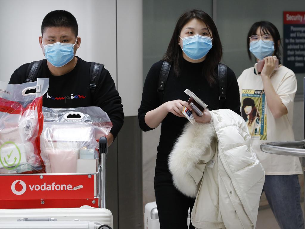 People wearing masks arrived at Sydney Airport. Picture: Chris Pavlich