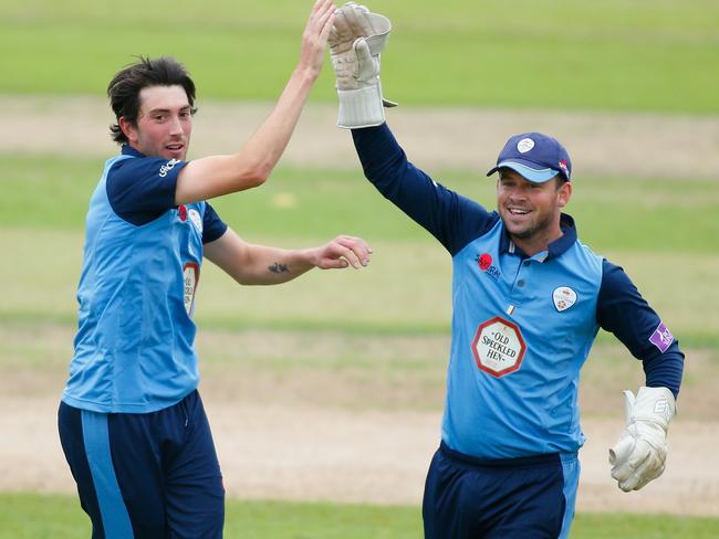 Derbyshire’s Mark Footitt celebrates a wicket with wicketkeeper Gareth Cross during a domestic ODI.