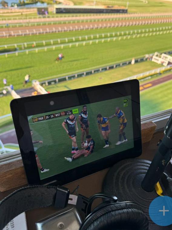 Race caller Darren Flindell cheering for Wests Tigers from his Warwick Farm commentary box. Picture: Supplied