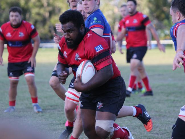 Gold Coast District Rugby Union (GCDRU) Round Six clash between Griffith Uni Colleges Knights (Red/Black) and Bond Pirates (Blue/Red) at Heeb St, Benowa. Lesi Semi carries.  Pic Mike Batterham