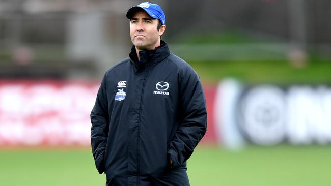 North Melbourne coach Brad Scott oversees training at Arden Street.