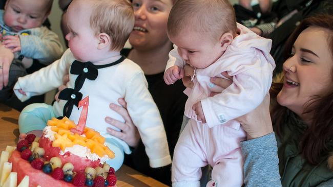 Raechal Robins with Evelyn, six months, and Jasmine Craig with Isabella, two months, celebrate the Babes Project’s Frankston service first birthday. Picture: Miranda Mayle