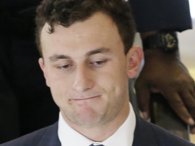 Former Cleveland Browns quarterback Johnny Manziel takes an escalator after making his initial court appearance, Thursday, May 5, 2016, in Dallas. The Heisman Trophy winner and former Texas A&M star was indicted by a grand jury last month after his ex-girlfriend alleged he hit her and threatened to kill her during a night out in January. (AP Photo/LM Otero)