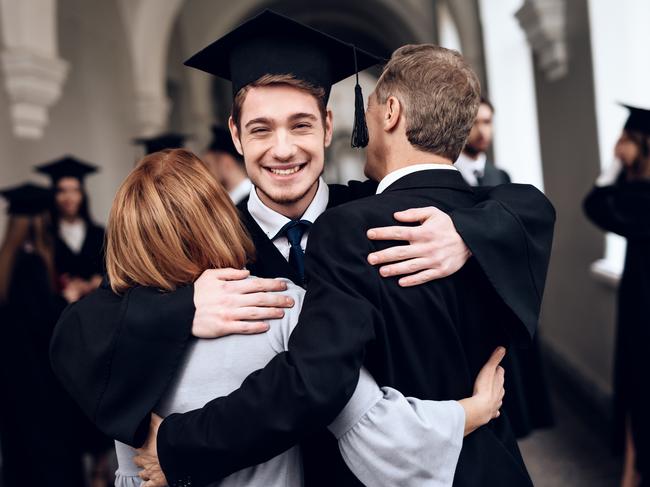 CAREERS. Parents congratulate the student, who finish their studies at the university. He graduates. They are very happy about this. University graduate. Picture: iStock