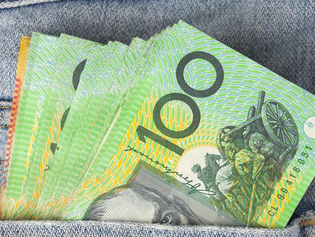 Australian 100 dollar notes in jeans pocket. money, wealthy, rich generic