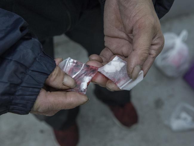 Vinny holds some of his heroin. Picture: Ian Currie