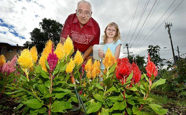 DIGGING IT: Wally Estreich of Goonellabah and his granddaughter Kaitlyn Willers from the Gold Coast, tend to his garden. Picture: Cathy Adams