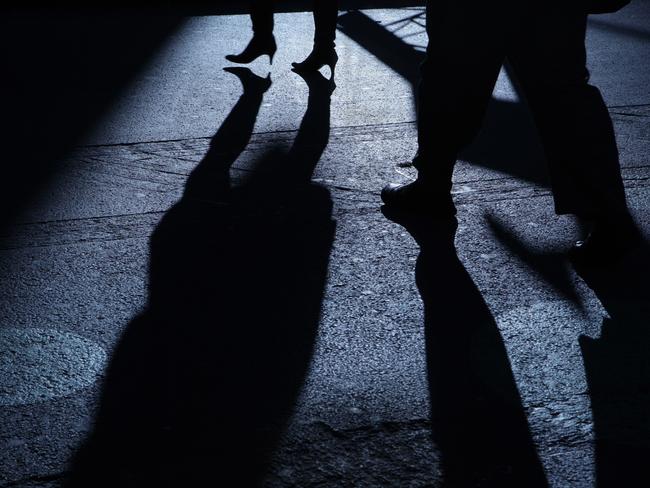 Stock image of a male following female in the dark night, a stalker. Picture: iStock