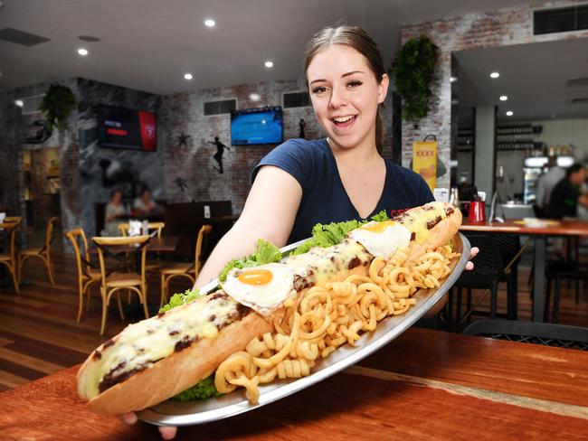 OBJ's Sports Bar team member Jessica Nolan with a 2 foot long hotdog. Picture: Shae Beplate.