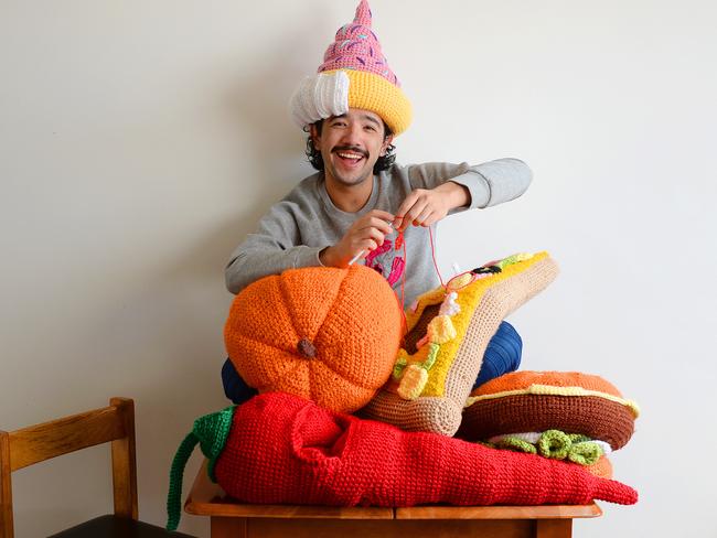 Phil Ferguson crafting his crocheted food-themed hats. Picture: Josie Hayden