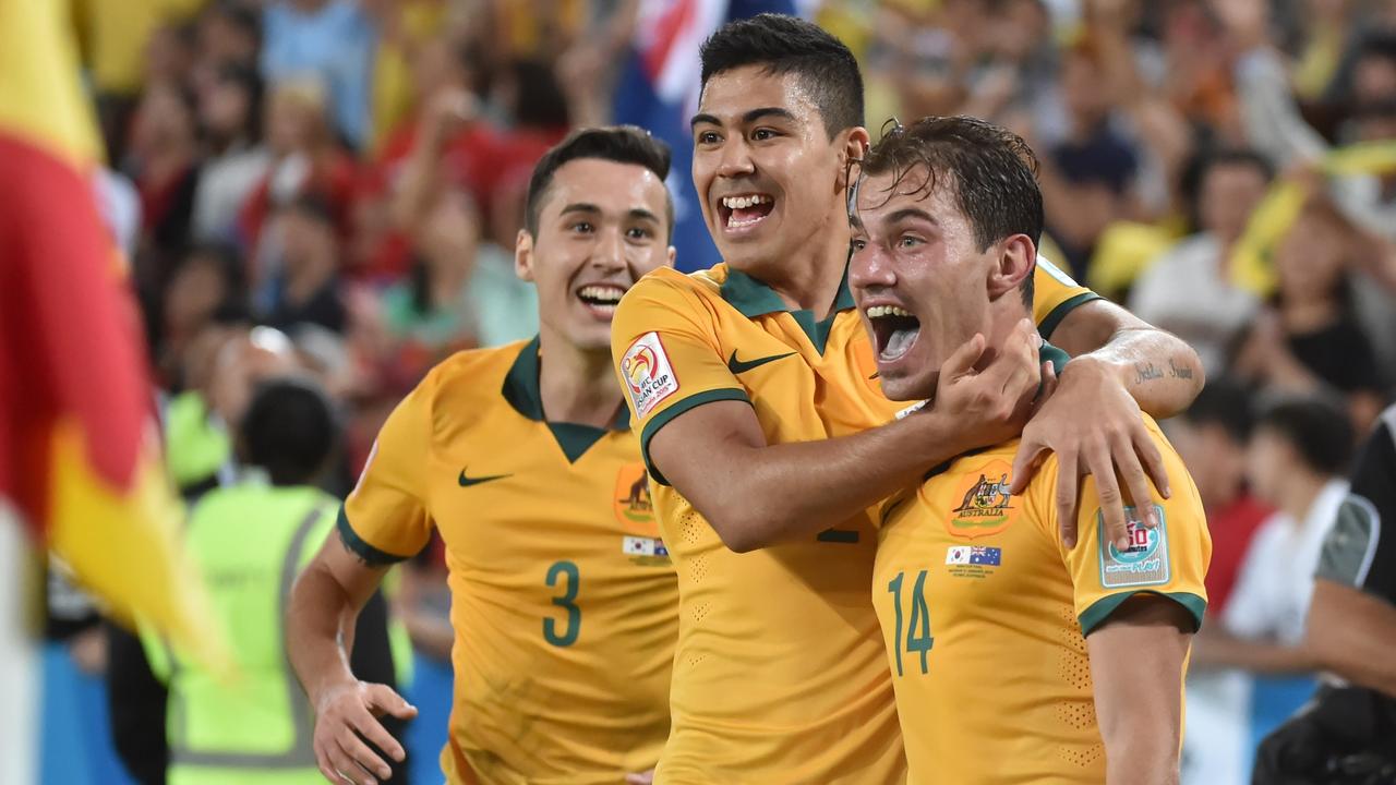 Australia's James Troisi (R) celebrates scoring with teammates Jason Davidson (L) and Massimo Luongo (C) during the AFC Asian Cup football final between South Korea and Australia at Stadium Australia in Sydney on January 31, 2015. AFP PHOTO / Peter PARKS -- IMAGE RESTRICTED TO EDITORIAL USE - STRICTLY NO COMMERCIAL USE