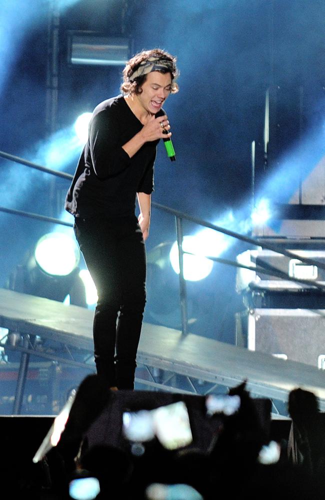 Graduated to big venues ... One Direction’s Harry Styles gets close to his fans at the concert in Santiago on April 30, 2014.