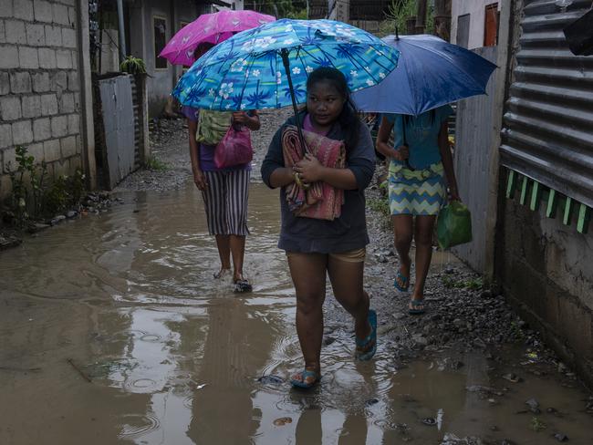 Residents evacuate to safer grounds as Typhoon Mangkhut approaches on September 14, 2018 in Tuguegarao city, northern Philippines. Picture: Jes Aznar/Getty Images