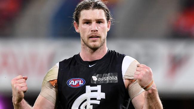 Bryce Gibbs celebrates after kicking a goal against Gold Coast.