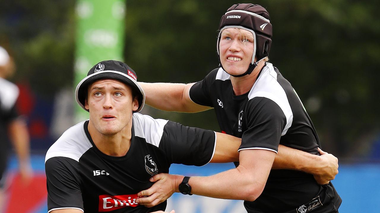 Sam McLarty (right) battles with Darcy Moore at Collingwood training last year. Photo: Michael Klein