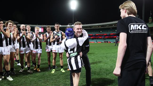 Buckley has an emotional moment after coaching his final game for the Magpies during the round 13 AFL match between the Melbourne Demons and the Collingwood Magpies at Sydney Cricket Ground on June 14, 2021. Picture: Matt King