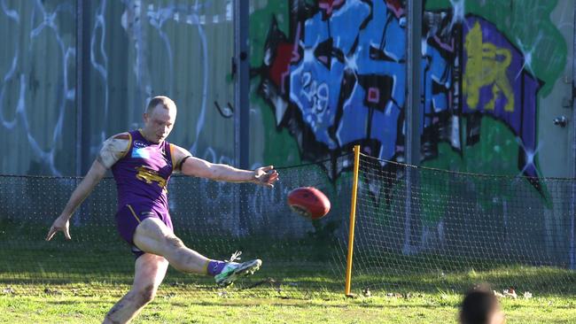 Luke Mccleary kicks the ball for Collegians.Picture: Stuart Milligan