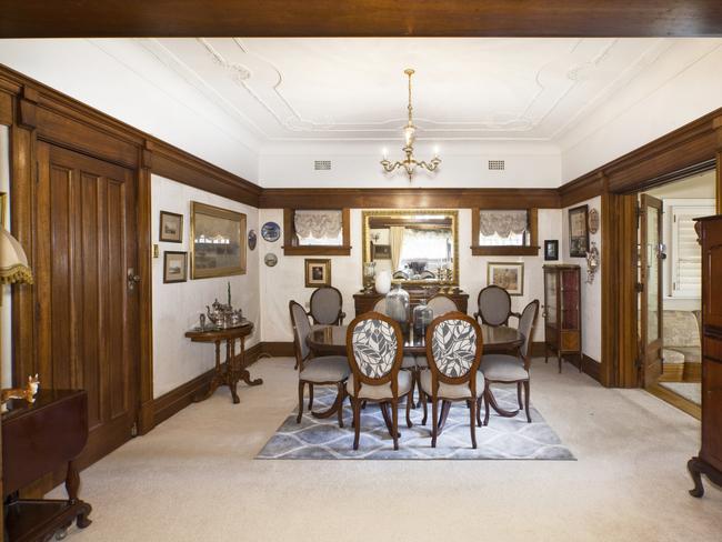 The separate formal dining room also has period features.